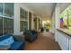 Cozy front porch featuring comfortable seating, offering an ideal spot for relaxation and outdoor enjoyment at 1883 Hall Point Rd, Mount Pleasant, SC 29466