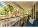 Relaxing front porch with cozy seating, perfect for enjoying the serene neighborhood views at 1883 Hall Point Rd, Mount Pleasant, SC 29466