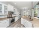 Bright, updated kitchen with granite countertops, stainless appliances, and modern fixtures at 1883 Hall Point Rd, Mount Pleasant, SC 29466