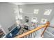 Bright loft area with a fireplace, built-in shelves, and a view of the living room below at 1883 Hall Point Rd, Mount Pleasant, SC 29466