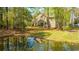 Scenic view of pond with lush greenery surrounding the backyard at 1883 Hall Point Rd, Mount Pleasant, SC 29466