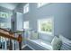 Upstairs landing featuring a cozy window seat with decorative pillows and natural lighting at 1883 Hall Point Rd, Mount Pleasant, SC 29466