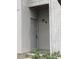 Unit front door with coded access in neutral painted wood building at 201 Greenmeadow Dr, Goose Creek, SC 29445