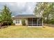 Well-maintained backyard with screened porch and mature trees, creating an inviting outdoor living space at 201 Island Green Rd, Goose Creek, SC 29445