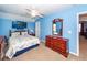 Spacious blue bedroom features a ceiling fan, large dresser, and carpeted flooring at 201 Island Green Rd, Goose Creek, SC 29445