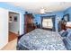 Bright bedroom features a ceiling fan, wooden furniture, and a door to the bathroom at 201 Island Green Rd, Goose Creek, SC 29445