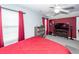 Bedroom with a red accent wall featuring a media center at 201 Island Green Rd, Goose Creek, SC 29445