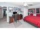 Bright bedroom features a ceiling fan, a built-in bookcase, and an office desk at 201 Island Green Rd, Goose Creek, SC 29445