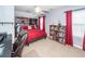 Bright bedroom features a ceiling fan, a built-in bookcase, and an office desk at 201 Island Green Rd, Goose Creek, SC 29445