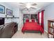 Bright bedroom features a ceiling fan, a built-in bookcase, and an office desk at 201 Island Green Rd, Goose Creek, SC 29445