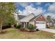 Charming single-Gathering home with a well-manicured lawn and a two-car garage and brick front at 201 Island Green Rd, Goose Creek, SC 29445