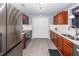 Kitchen boasts stainless steel appliances, white subway tile backsplash, and wood cabinets at 201 Island Green Rd, Goose Creek, SC 29445