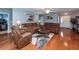 Spacious living room featuring hardwood floors, comfortable seating, and ample natural light at 201 Island Green Rd, Goose Creek, SC 29445