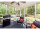 Covered porch with a gas grill and a fenced in backyard view at 201 Island Green Rd, Goose Creek, SC 29445