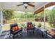 Enclosed porch with outdoor seating and view of a fenced in backyard at 201 Island Green Rd, Goose Creek, SC 29445