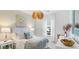 Comfortable bedroom with soft lighting, patterned wallpaper, and neutral accents at 203 Belfort Pl, Summerville, SC 29486