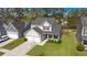 Aerial view of a two-story house with a green lawn, surrounded by trees, and a private driveway at 206 Alpine Rd, Summerville, SC 29485