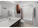 Well-lit bathroom featuring a tub, shower, and dark brown vanity at 206 Alpine Rd, Summerville, SC 29485