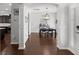 Open-concept dining room with hardwood floors, modern lighting, and view of the kitchen at 206 Alpine Rd, Summerville, SC 29485