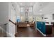 Spacious living room with high ceilings, fireplace, dark floors, and comfortable seating in a modern home at 206 Alpine Rd, Summerville, SC 29485