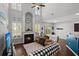 Inviting living room boasts a fireplace, high ceilings, large windows, and cozy seating with a view into the kitchen at 206 Alpine Rd, Summerville, SC 29485