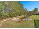 Scenic view of a tranquil pond surrounded by lush trees and greenery at 206 Alpine Rd, Summerville, SC 29485