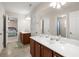 Bright bathroom with double sinks, and decorative features at 210 Sabal Palmetto Ct, Moncks Corner, SC 29461