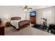 Relaxing bedroom with a wooden bed frame, natural light and exercise equipment at 210 Sabal Palmetto Ct, Moncks Corner, SC 29461