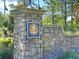 Stone community sign for Cypress Ridge neighborhood featuring lush landscaping and mature trees at 210 Sabal Palmetto Ct, Moncks Corner, SC 29461