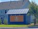 Community sign on a wooden structure with lights at 210 Sabal Palmetto Ct, Moncks Corner, SC 29461