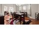 Formal dining room featuring a chandelier, large windows, and ample space for Gathering gatherings at 210 Sabal Palmetto Ct, Moncks Corner, SC 29461