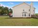 The home exterior features vinyl siding, an outdoor patio, and a lush, well-maintained lawn at 210 Sabal Palmetto Ct, Moncks Corner, SC 29461