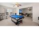 Game room features a pool table with bar-style seating, and neutral decor at 210 Sabal Palmetto Ct, Moncks Corner, SC 29461