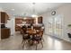 Open concept kitchen features wooden cabinetry, island, and a breakfast nook with backyard access at 210 Sabal Palmetto Ct, Moncks Corner, SC 29461