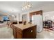 Spacious kitchen island with seating connects to dining and living areas at 210 Sabal Palmetto Ct, Moncks Corner, SC 29461