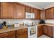 Beautiful kitchen featuring wooden cabinetry, modern appliances, and ample counter space at 210 Sabal Palmetto Ct, Moncks Corner, SC 29461