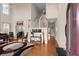 Spacious living room with soaring ceilings, hardwood floors, and a staircase, creating a dramatic and inviting atmosphere at 210 Sabal Palmetto Ct, Moncks Corner, SC 29461