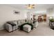 Open-concept living room showcases a large sectional sofa and seamless flow to the kitchen at 210 Sabal Palmetto Ct, Moncks Corner, SC 29461