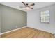 Spacious bedroom features a painted accent wall, a window, and wood-look vinyl plank flooring at 213 Braly Dr, Summerville, SC 29485