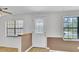 Inviting entryway with a decorative glass front door and natural light from two windows at 213 Braly Dr, Summerville, SC 29485