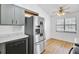 Modern kitchen with stainless steel appliances, marble countertops, and adjacent dining area at 213 Braly Dr, Summerville, SC 29485