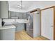 The kitchen features ample gray cabinetry, stainless steel appliances, and plenty of countertop space at 213 Braly Dr, Summerville, SC 29485
