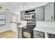 The kitchen features ample gray cabinetry, stainless steel appliances, and plenty of countertop space at 213 Braly Dr, Summerville, SC 29485