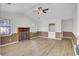 Bright living room with a cozy fireplace and updated flooring and windows at 213 Braly Dr, Summerville, SC 29485