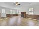 Inviting living room with natural light, a classic fireplace and updated flooring at 213 Braly Dr, Summerville, SC 29485