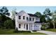Charming two-story home featuring a white exterior, covered porch, and attached two-car garage at 221 Yalton St, Summerville, SC 29486