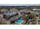 Aerial view of the condo and community pool, showing the building's layout and its scenic surroundings and neighborhood at 2244 Ashley Crossing Dr # 1232, Charleston, SC 29414