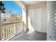 Outdoor balcony providing a cozy space with a view, complemented by a modern lighting fixture at 2244 Ashley Crossing Dr # 1232, Charleston, SC 29414