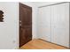 Bright entryway featuring beautiful hardwood floors, coat closet, and a dark-stained front door at 2244 Ashley Crossing Dr # 1232, Charleston, SC 29414