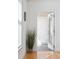 Hallway with natural light, showcasing a view to another room through an open door at 2244 Ashley Crossing Dr # 1232, Charleston, SC 29414